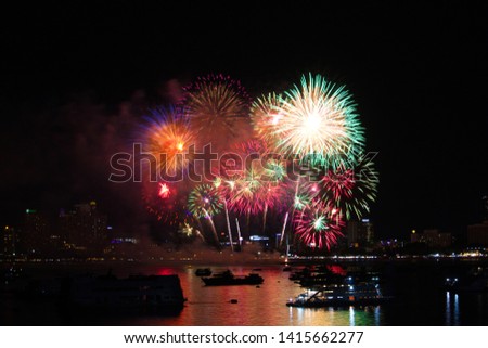Pattaya city thailand fireworks on beach and reflection color on water surface