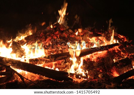 A campfire with lots of coals and low fire. A beautiful picture is suitable to be a background or inspiration picture. Photographed in Lag BaOmer in Israel