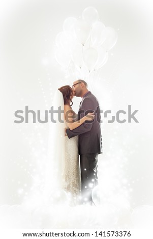 Bride and groom kissing on their wedding day.