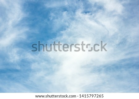 White clouds on a blue sky. The concept of screensavers on your desktop computer. The concept of printing for a stretch ceiling.