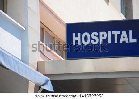 
Entrance of a Hospital with a hospital sign