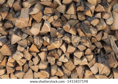 The texture of firewood laid out on each other.