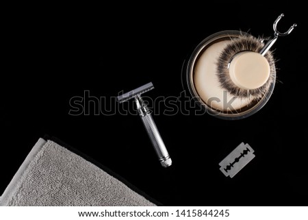 Traditional wet shaving. Shaving brush, safety razor, towel and soap. Royalty-Free Stock Photo #1415844245