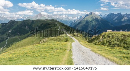 Panorama of a mountain bike trail in the Alps Royalty-Free Stock Photo #1415849195