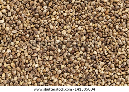 background of organic dried hemp seeds Royalty-Free Stock Photo #141585004