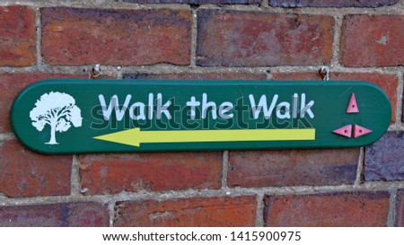 A sign telling visitors which way to walk at Arley Arboretum in the Midlands in England.