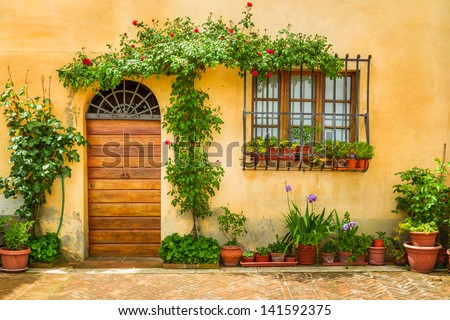 Beautiful porch decorated with flowers in italy Royalty-Free Stock Photo #141592375