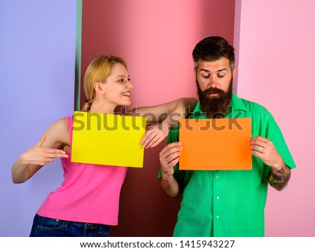Surprised couple holding advertising board. Advertising. Sale. Online shopping. Advertising banner. Seasons sale. Discount. Marketing. Add. Copy space for text.