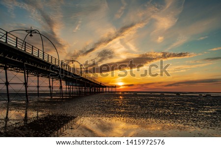 Sunset Over Southport Pier and Beach Merseyside UK Royalty-Free Stock Photo #1415972576