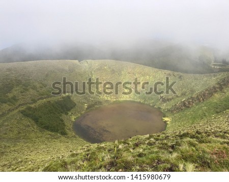 Hiking on the top of the crater of the island. São Miguel is the largest island of the Azores, with a landscape of forest-wrapped volcanic peaks, azure lakes and perfect calderas.