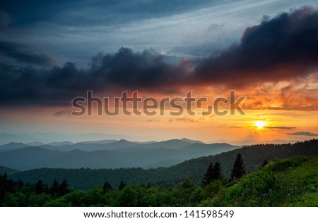 The clouds are rising as the sun is setting on the Blue Ridge Parkway near Asheville and Waynesville, North Carolina.