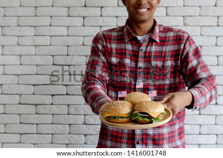 Background textures of man Showing hamburger on the trencher concept.