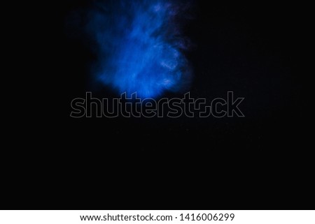 Colorful powder explosion  isolated on black background