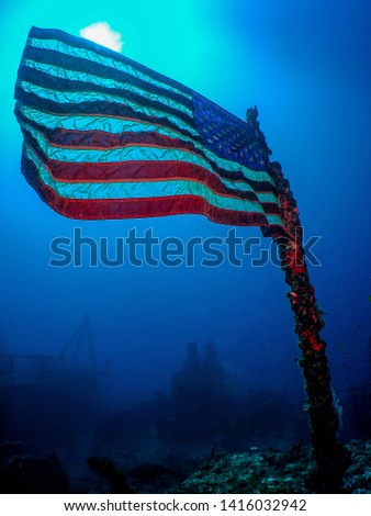 The United States Flag on the Sunken Wreck of the USCG Duane in Key Largo, Florida Royalty-Free Stock Photo #1416032942