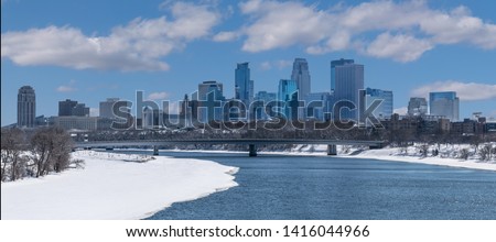 Partially Frozen Mississippi River and Minneapolis Downtown during Winter