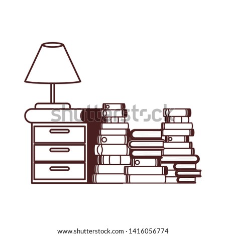 silhouette of wooden drawer with stack of books