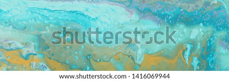 photography of abstract marbleized effect background. Blue, mint and white creative colors. Beautiful paint with the addition of gold.