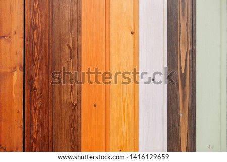 Colored wooden samples board with screws texture background