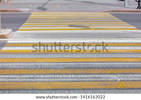 Pedestrian crossing painted on asphalt in the city