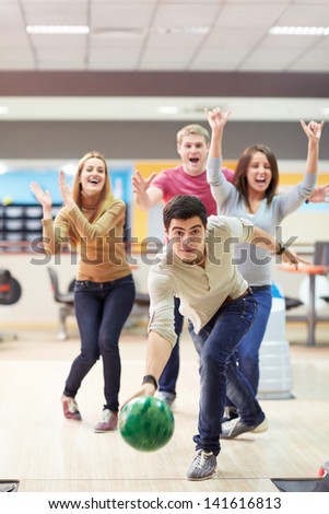 Young man playing bowling