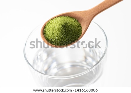 Green juice powder, dissolve in water and drink  Healthy food.
