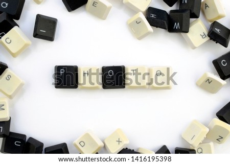 computers and computer technologies in industries and fields of human activity - concept. a photo. The word is laid out on a white background from the scattered keys of the computer keyboard - photo