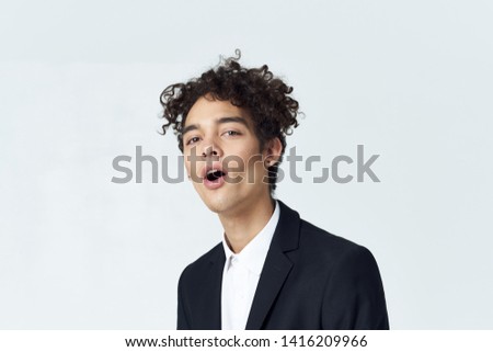 Curly guy in a suit cropped look                    
