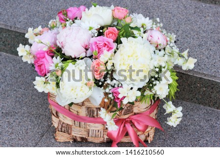 arrangement in a basket of fresh flowers