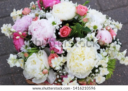 arrangement in a basket of fresh flowers