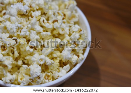 pop corn in white bowl