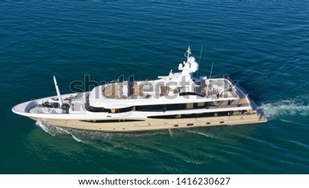 Aerial drone photo of luxury yacht cruise in mediterranean deep blue sea