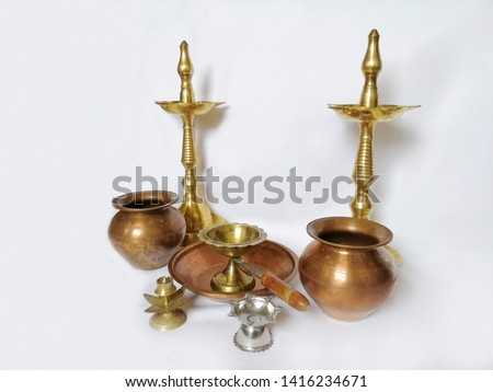 Puja stuff or puja thali with white background includig kalash agarbatti diya dhup samai agarbatti holder