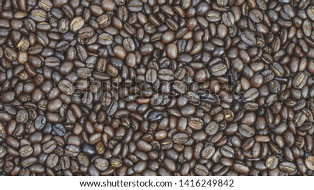 Brown roasted coffee beans background view. I love coffee with aroma. Top view or (Flat lay). 