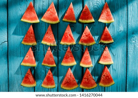 Fresh tasty watermelon on blue wooden board and summer time 