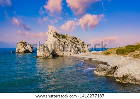 Cyprus. Aphrodite's rock at sunset. Petra-Tu-Romiou. Bay of Aphrodite. Mediterranean sea. Seascape rocks. Paphos. Kouklia.  The Cyprus beaches. Turquoise sea. Coast of the Republic of Cyprus. Royalty-Free Stock Photo #1416277187