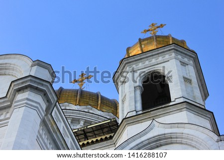 Church bell tower and domes with cross at Cathedral of Christ the Saviour in Moscow, Russia 