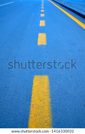  Asphalt with yellow markings bright                              