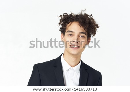 Cheerful handsome business man in a suit blue background model professional Professional