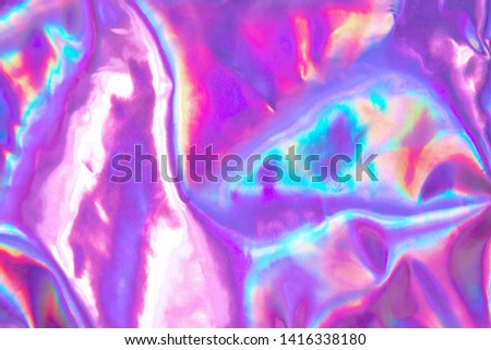 Abstract trendy holographic background. Real texture in violet, pink and mint colors with scratches and irregularities