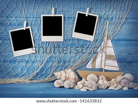 Marine life decoration and instant photos on blue shabby background