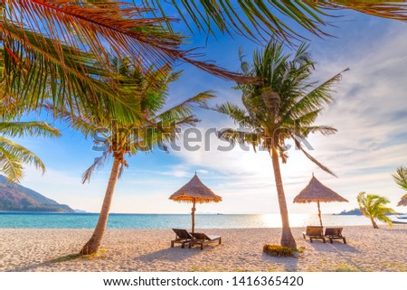 Beach chairs, umbrella and palms on the beautiful beach for holidays and relaxation at Koh Lipe island, Thailand
 Royalty-Free Stock Photo #1416365420