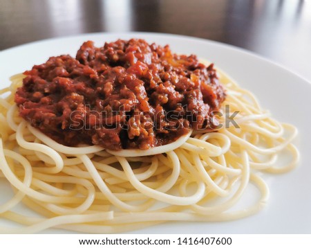 Spaghetti Bolognese with minced beef, onion, chopped tomato, garlic, olive oil, stock cube, tomato puree and Italian herb  Traditional Italian food. 