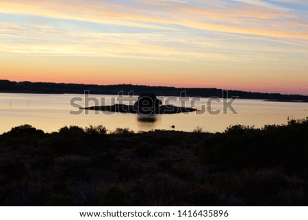 Sunrise over sea inlet at Camping Le Fun, Languedoc Roussillon, France Royalty-Free Stock Photo #1416435896