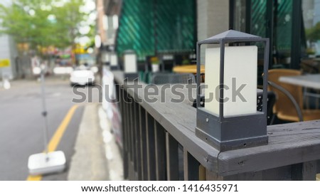 an outdoor deck lamp in a cafe