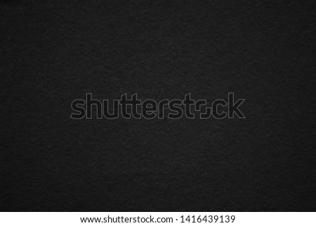 Black paper or cardboard or paper texture as background