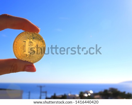 Concept with bitcoin. Bitcoin in hand