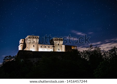 Torrechiara Castle by Cloudy Stars Night