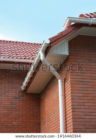 Close up view on House Problem Areas for Rain Gutter Waterproofing Outdoor. Home Guttering, Gutters, Plastic Guttering System, Guttering & Drainage Pipe Exterior