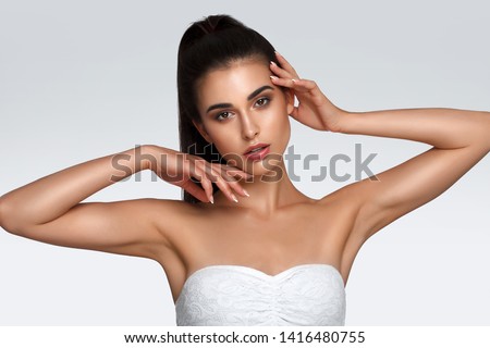 Armpit skin care, hair removal and hair removal concept, smooth clean soft skin. The woman raised hands up Royalty-Free Stock Photo #1416480755