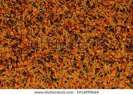 Red, brown, orange, black fluffy fabric texture pattern. Abstract background. 